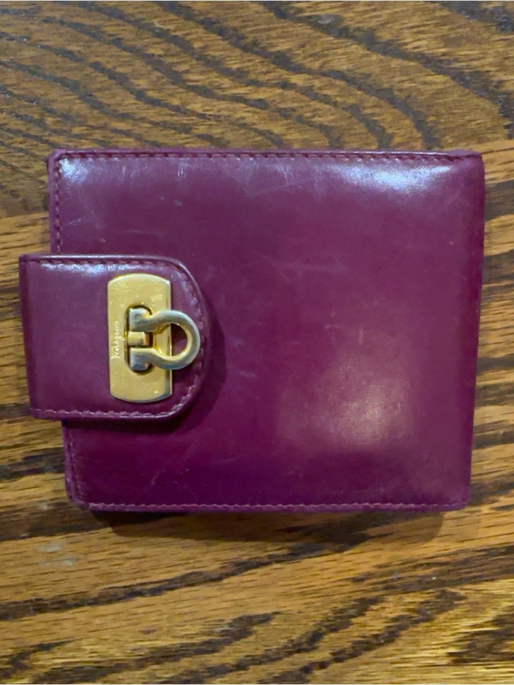 Salvatore Ferragamo Plum Leather Bifold Wallet with Gold Hardware